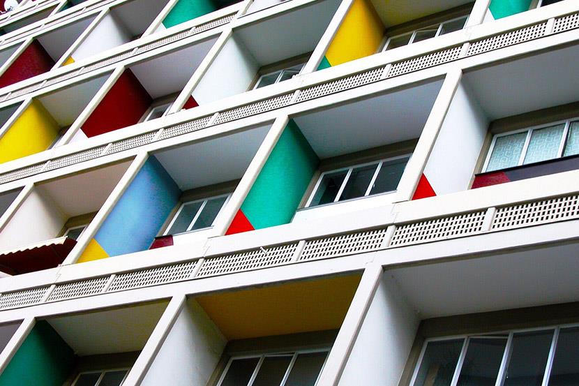 angled shot of multicolored apartment balconies